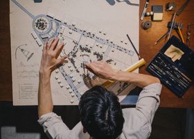 Illustrated city maps on a library table